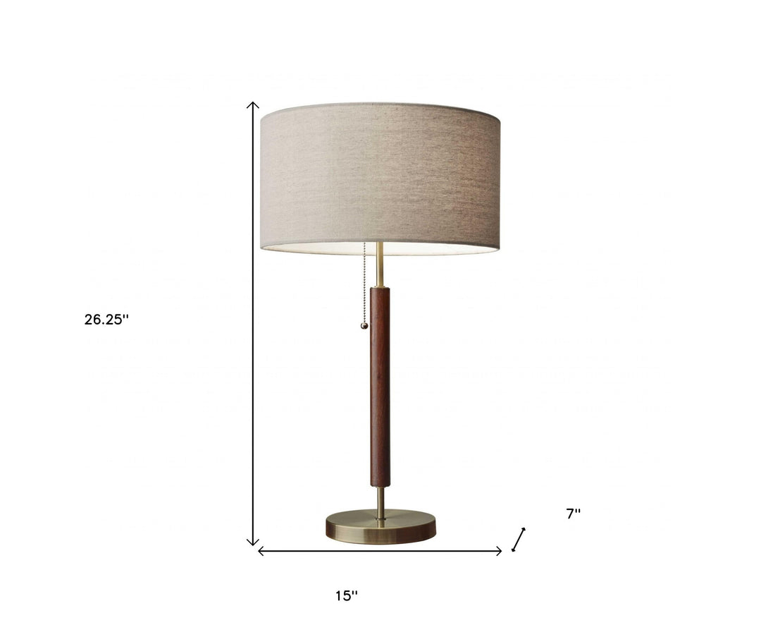 26" Antiqued Brass Solid Wood Table Lamp With Beige Drum Shade