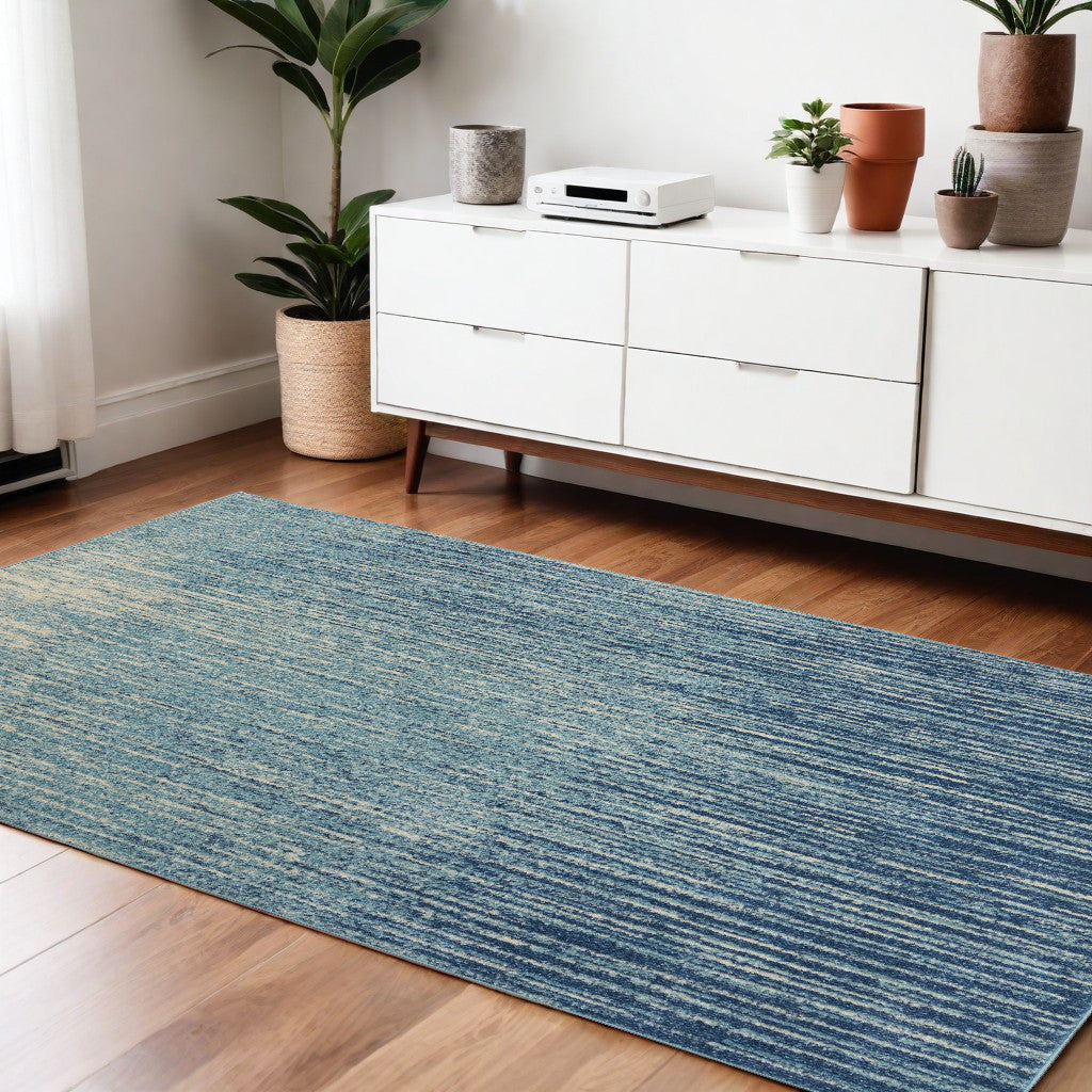 2' X 3' Blue and Ivory Abstract Power Loom Area Rug