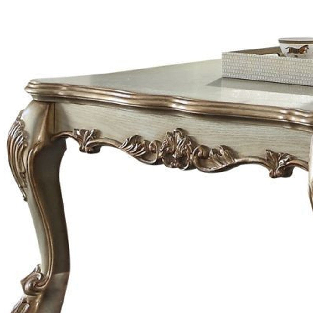 Refined Elegance: 54-Inch Bone and Gold Patina Rectangular Coffee Table