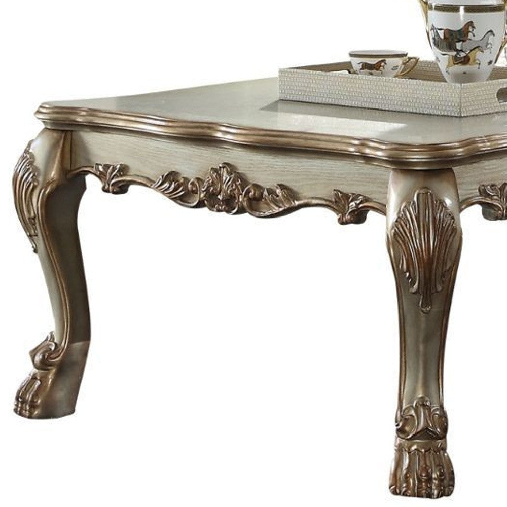 Refined Elegance: 54-Inch Bone and Gold Patina Rectangular Coffee Table