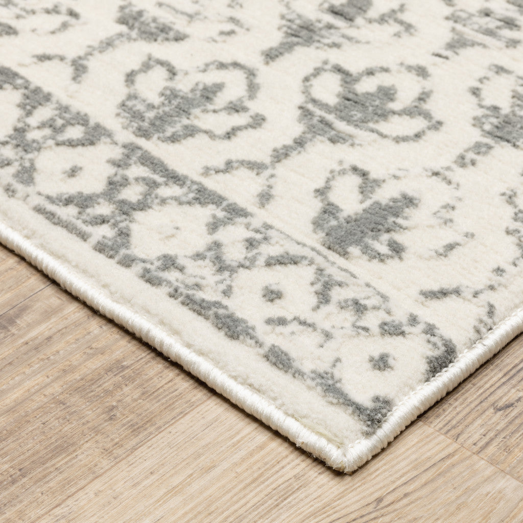 4' X 6' Ivory And Grey Floral Power Loom Stain Resistant Area Rug