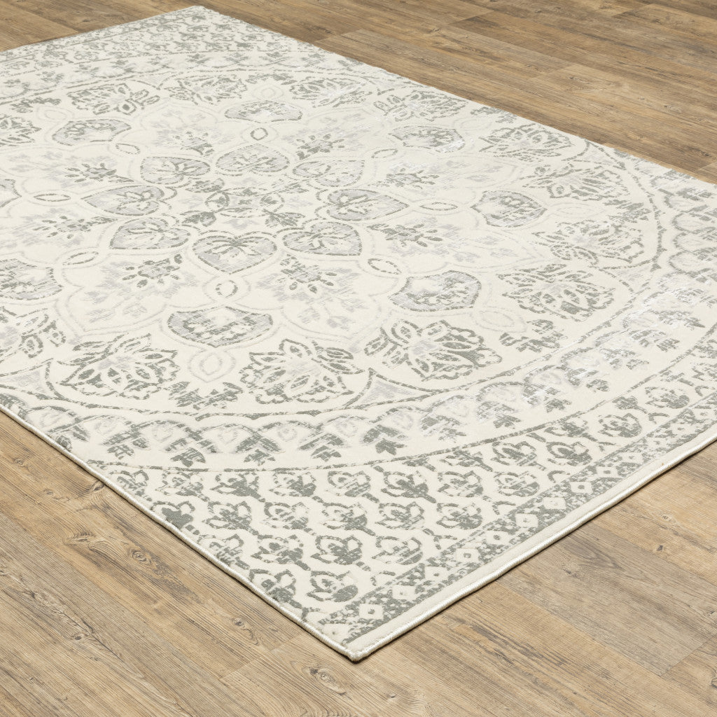 4' X 6' Ivory And Grey Floral Power Loom Stain Resistant Area Rug