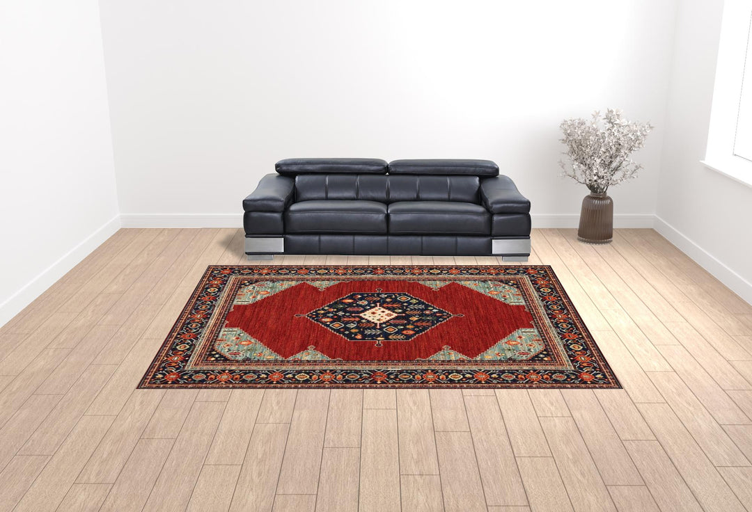 2' X 3' Red Blue Orange And Ivory Oriental Power Loom Stain Resistant Area Rug With Fringe