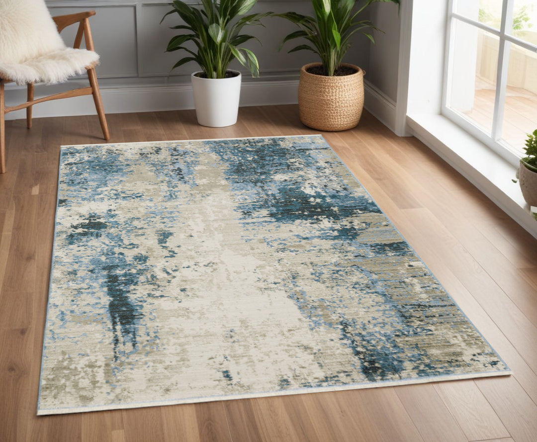 2' X 8' Blue Grey Ivory Light Blue And Dark Blue Abstract Power Loom Stain Resistant Runner Rug With Fringe