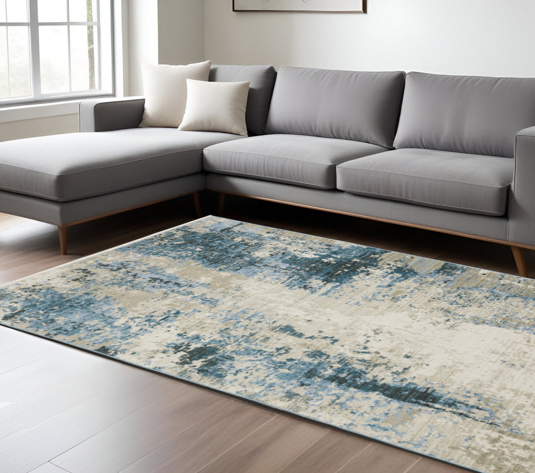 2' X 8' Blue Grey Ivory Light Blue And Dark Blue Abstract Power Loom Stain Resistant Runner Rug With Fringe