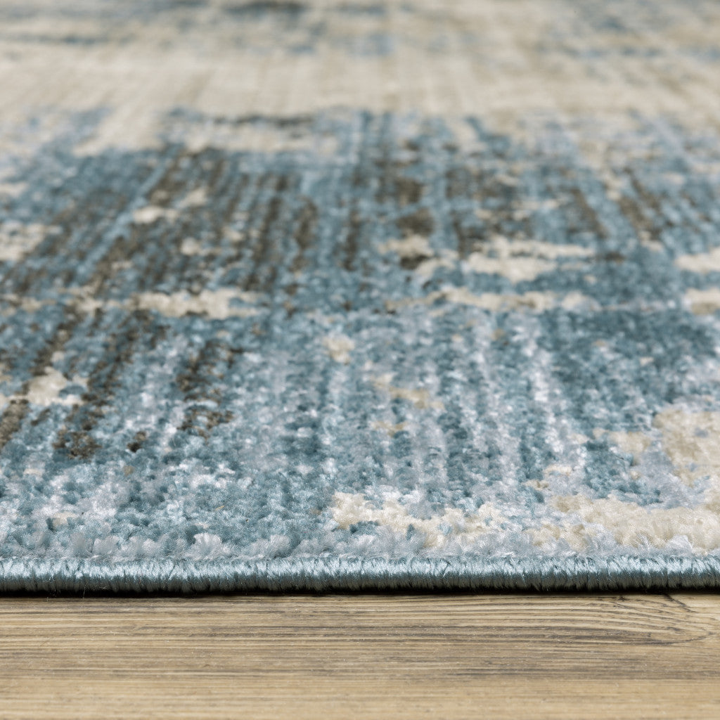 2' X 8' Blue Grey Ivory Light Blue And Dark Blue Abstract Power Loom Stain Resistant Runner Rug With Fringe