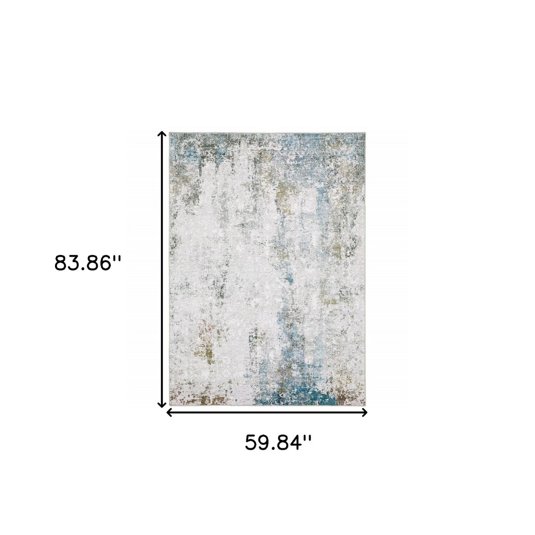 5' X 7' Ivory Teal Blue Grey Brown And Gold Abstract Printed Stain Resistant Non Skid Area Rug