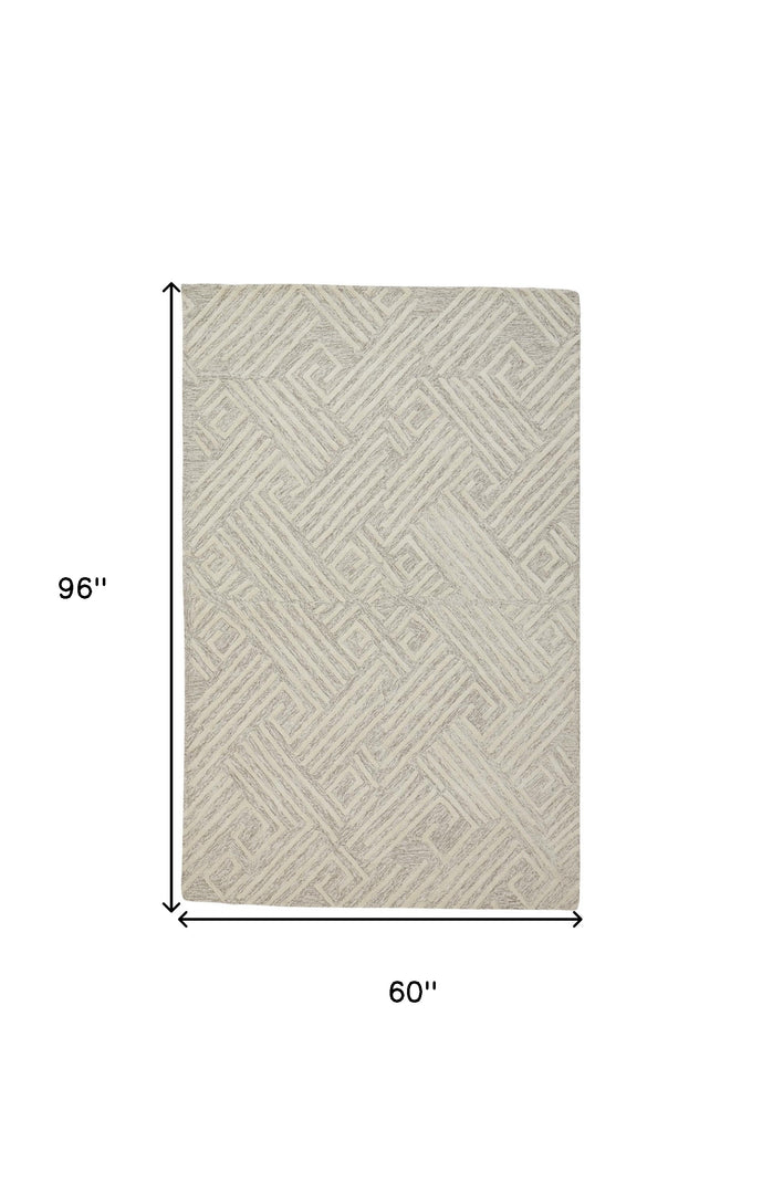 5' X 8' Tan And Ivory Wool Geometric Tufted Handmade Stain Resistant Area Rug