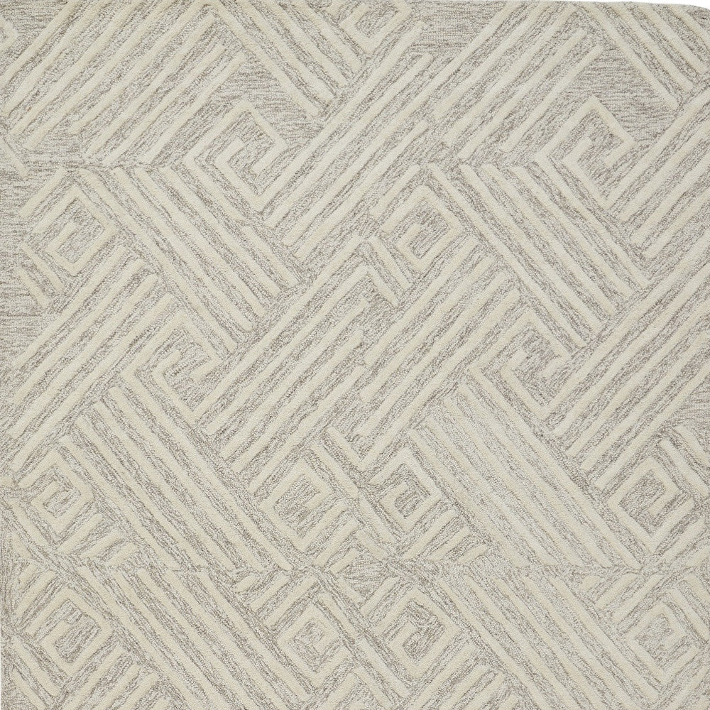 5' X 8' Tan And Ivory Wool Geometric Tufted Handmade Stain Resistant Area Rug