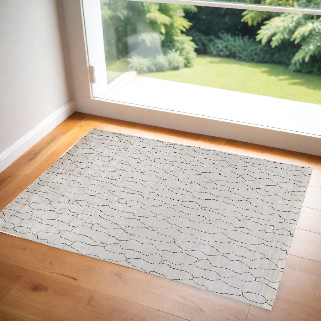 4' X 6' Gray and Ivory Abstract Hand Woven Area Rug