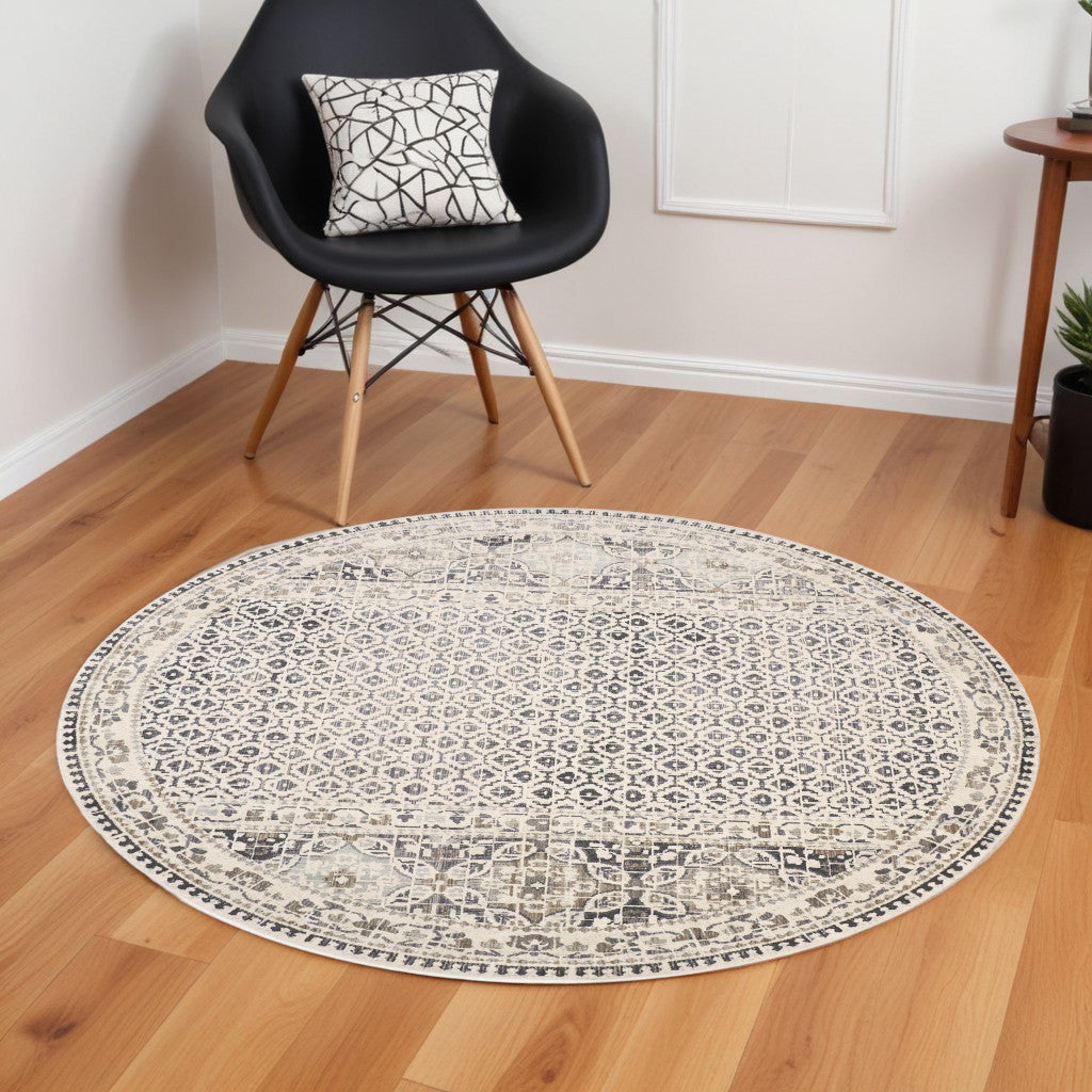 9' Ivory and Black Round Abstract Area Rug