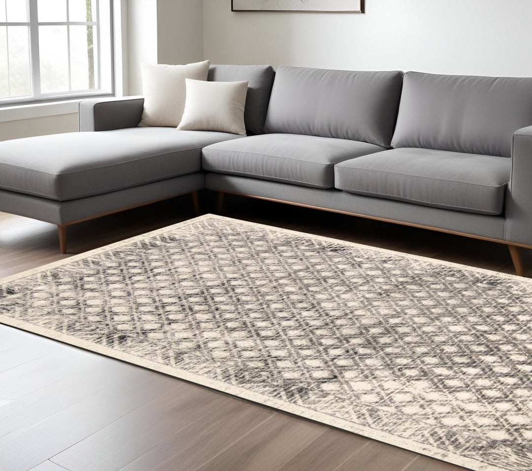 7' X 10' Ivory and Black Abstract Area Rug