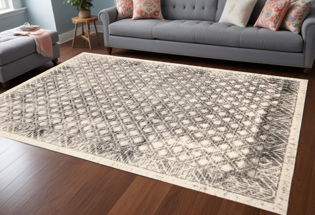 7' X 10' Ivory and Black Abstract Area Rug