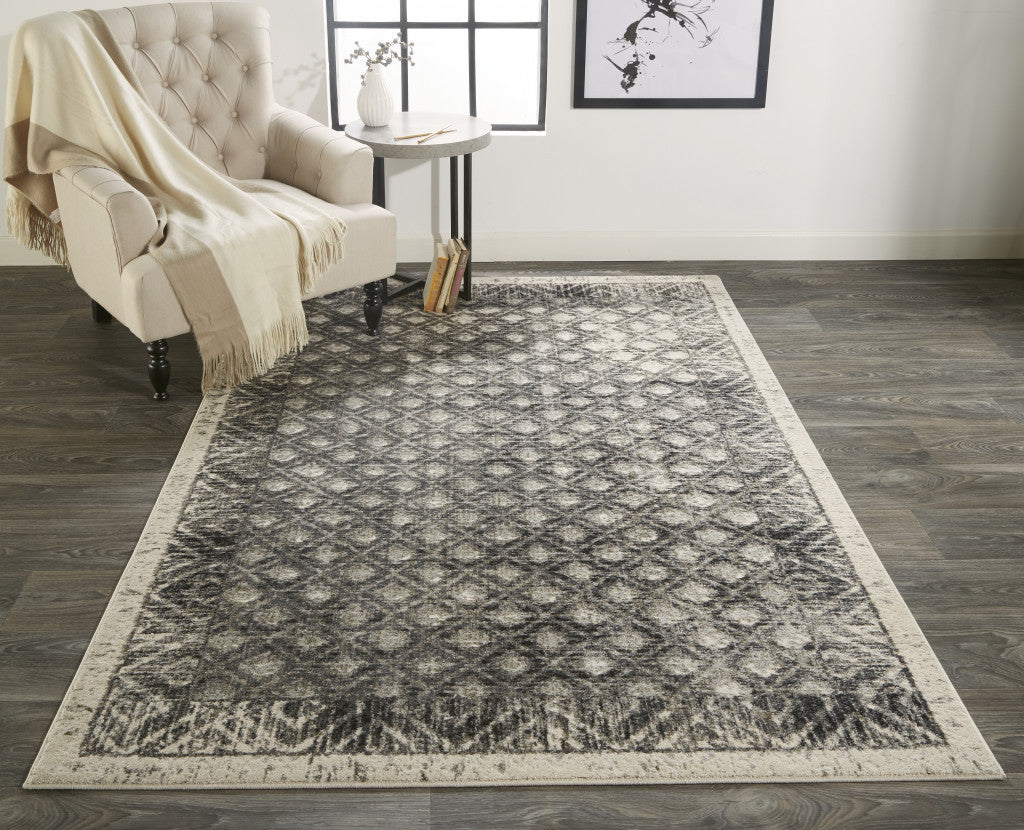 7' X 10' Ivory and Black Abstract Area Rug