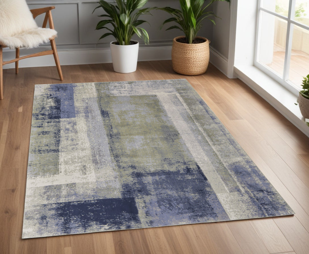 4' X 6' Blue and Ivory Abstract Power Loom Distressed Area Rug