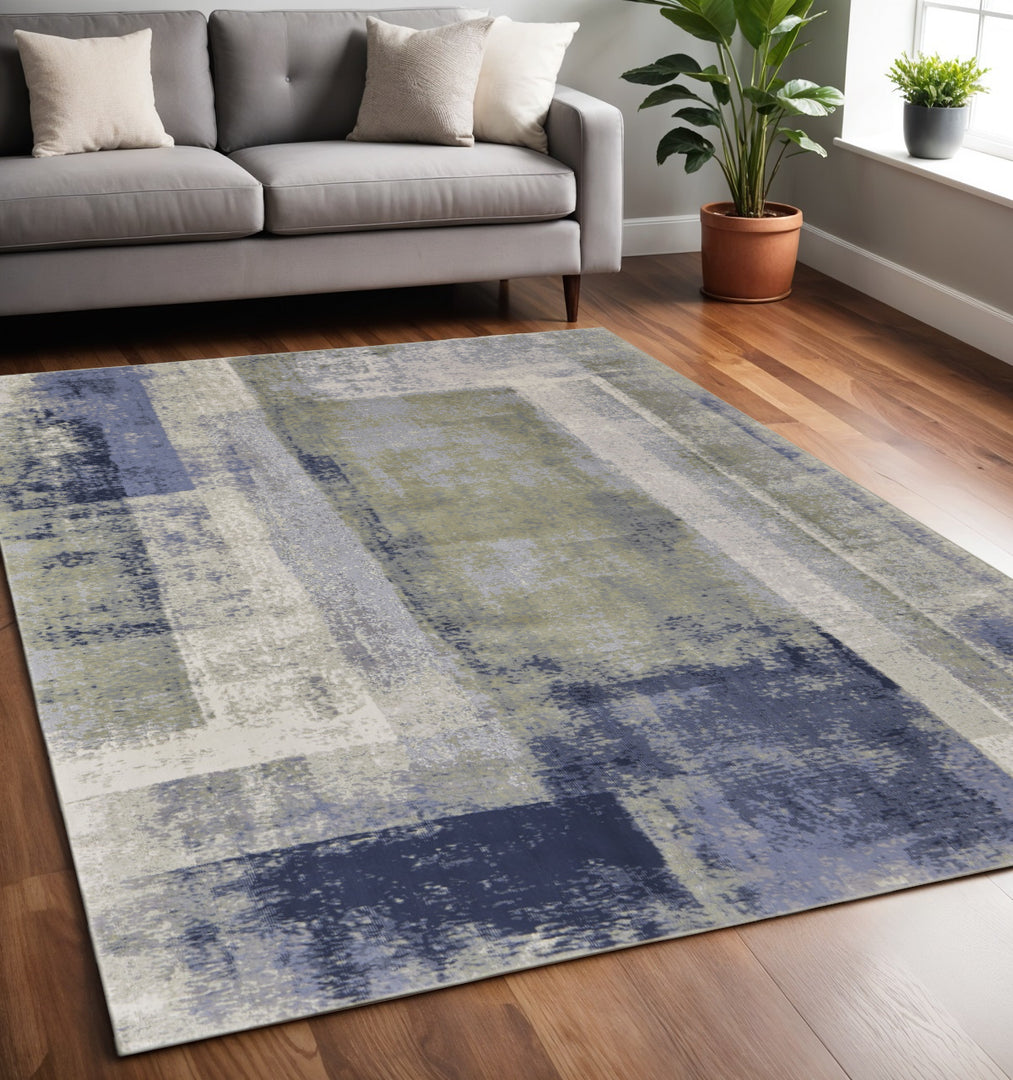 4' X 6' Blue and Ivory Abstract Power Loom Distressed Area Rug