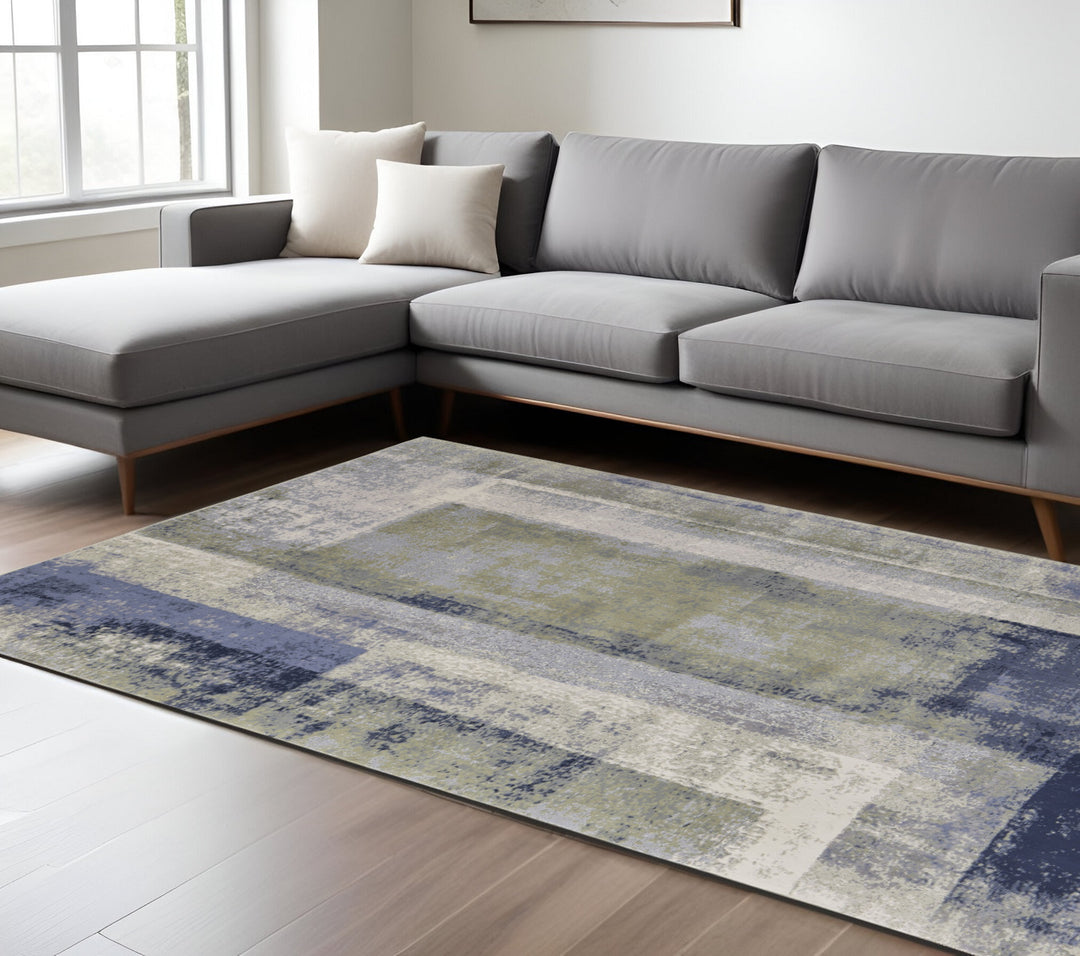 4' X 6' Blue and Ivory Abstract Power Loom Distressed Area Rug