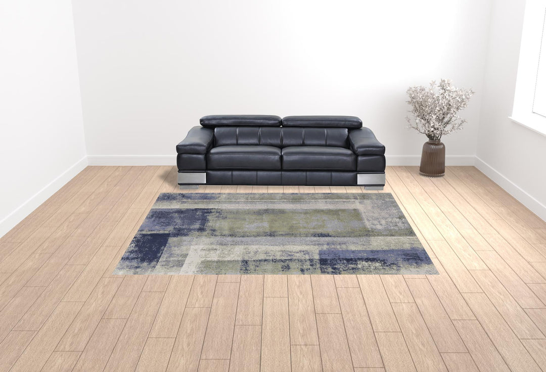 4' X 6' Blue and Ivory Abstract Power Loom Distressed Area Rug