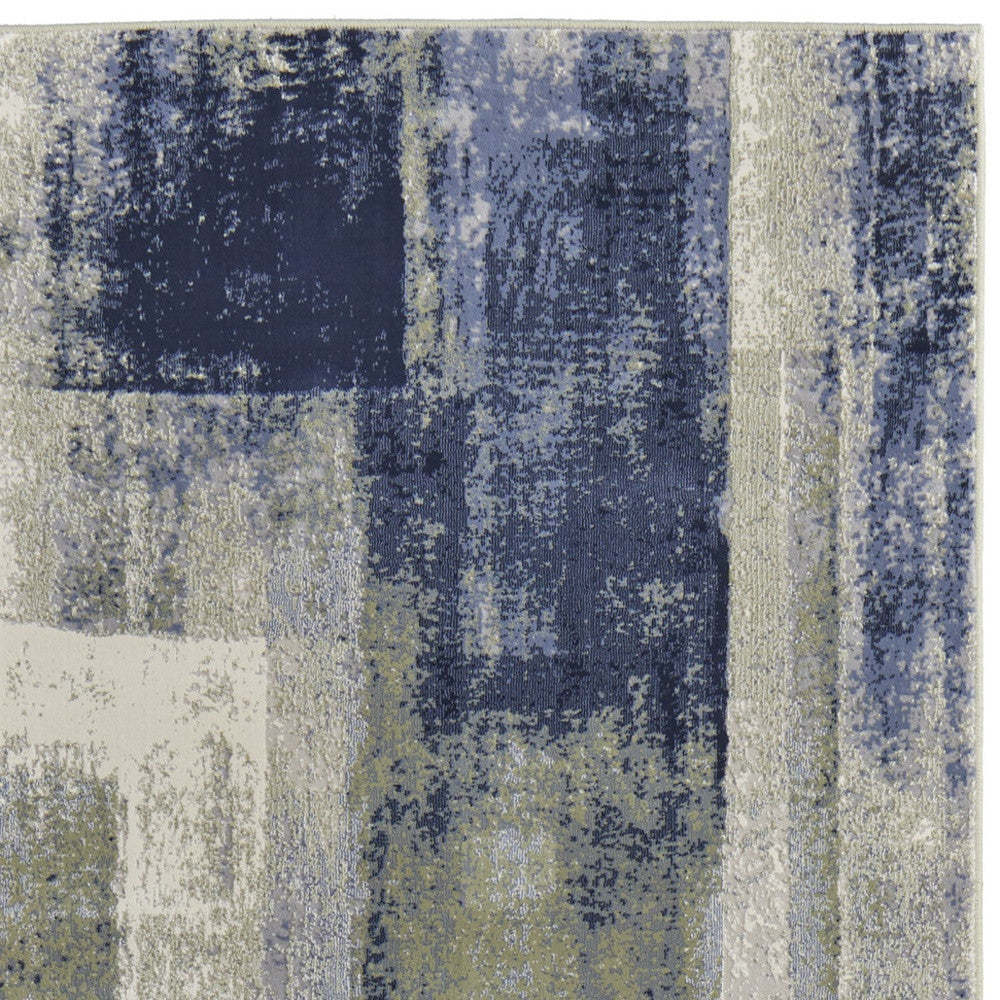 4' X 6' Blue and Ivory Abstract Power Loom Distressed Area Rug