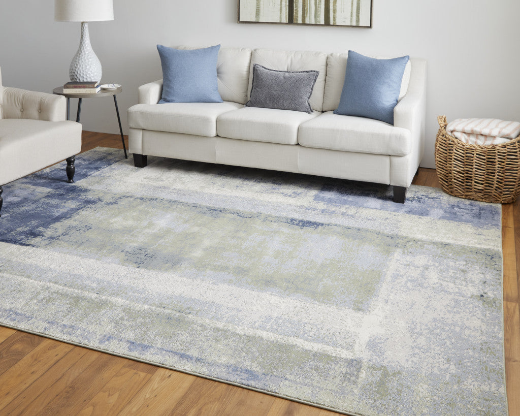 4' X 6' Blue and Ivory Abstract Power Loom Distressed Area Rug