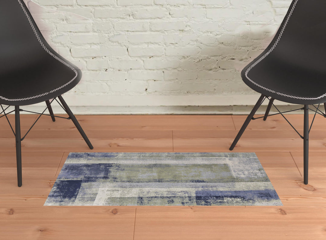 4' X 6' Blue and Ivory Abstract Power Loom Distressed Area Rug