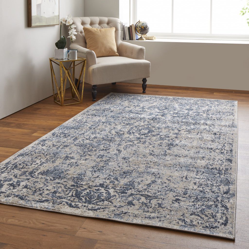 8' X 10' Blue And Ivory Floral Power Loom Distressed Area Rug