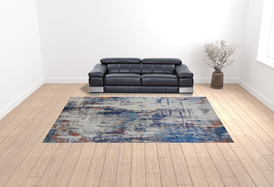 7' X 10' Ivory And Blue Abstract Power Loom Distressed Stain Resistant Area Rug