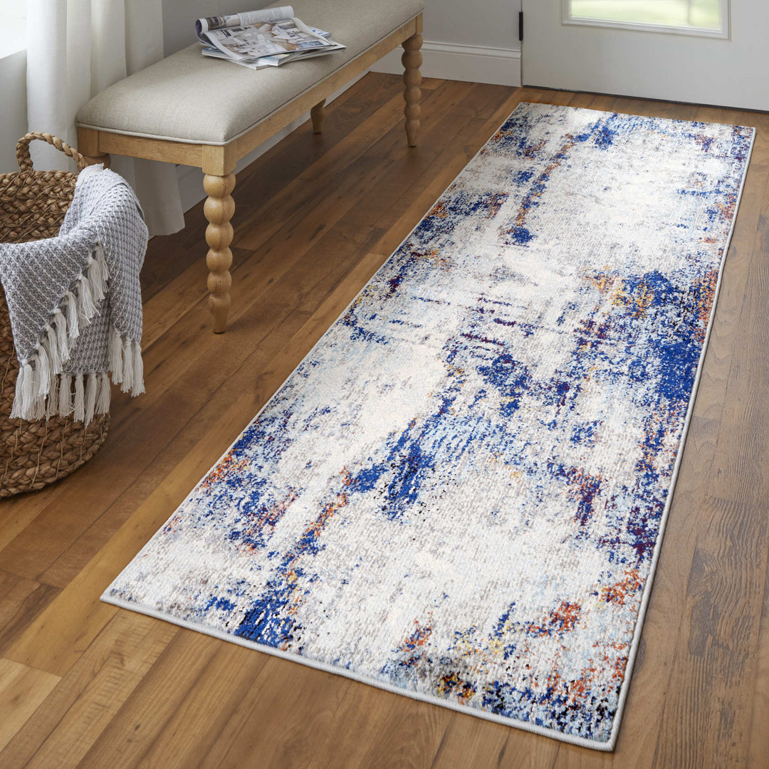 7' X 10' Ivory And Blue Abstract Power Loom Distressed Stain Resistant Area Rug