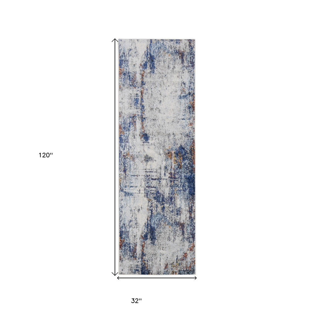 7' X 10' Ivory And Blue Abstract Power Loom Distressed Stain Resistant Area Rug