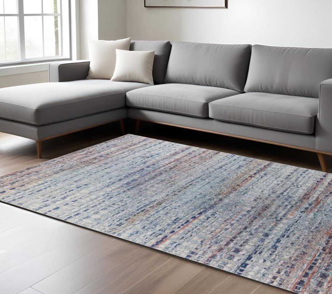 3' X 5' Blue Ivory And Orange Abstract Power Loom Stain Resistant Area Rug