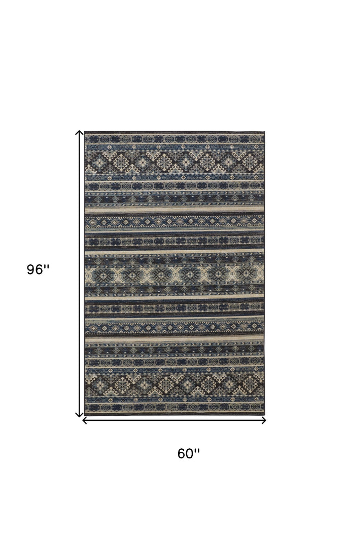 5' X 8' Blue Tan And Black Geometric Power Loom Distressed Stain Resistant Area Rug