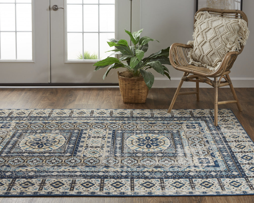 5' X 8' Ivory Tan And Blue Abstract Power Loom Distressed Stain Resistant Area Rug