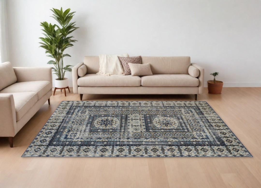 5' X 8' Ivory Tan And Blue Abstract Power Loom Distressed Stain Resistant Area Rug