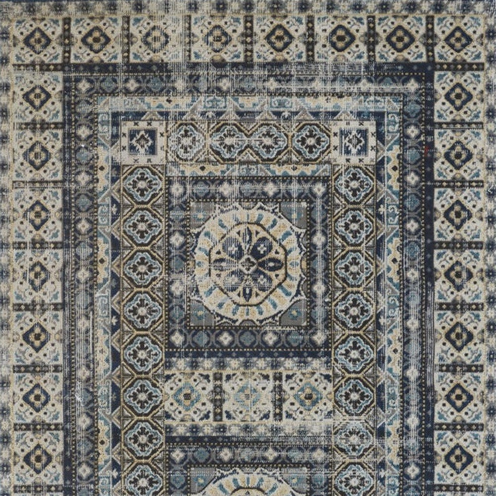 5' X 8' Ivory Tan And Blue Abstract Power Loom Distressed Stain Resistant Area Rug