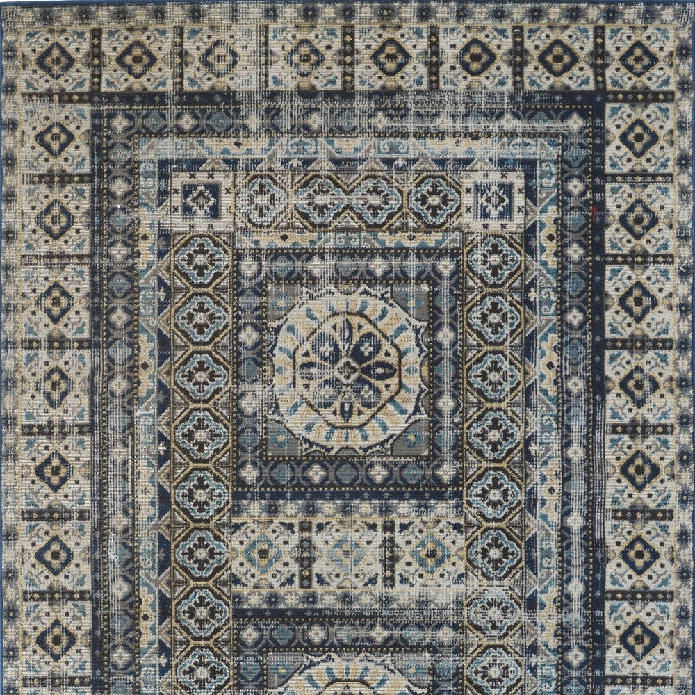 5' X 8' Ivory Tan And Blue Abstract Power Loom Distressed Stain Resistant Area Rug