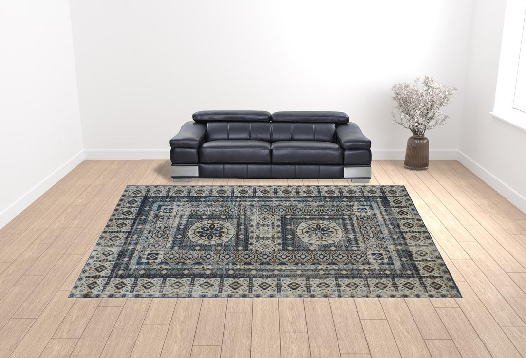 5' X 8' Ivory Tan And Blue Abstract Power Loom Distressed Stain Resistant Area Rug