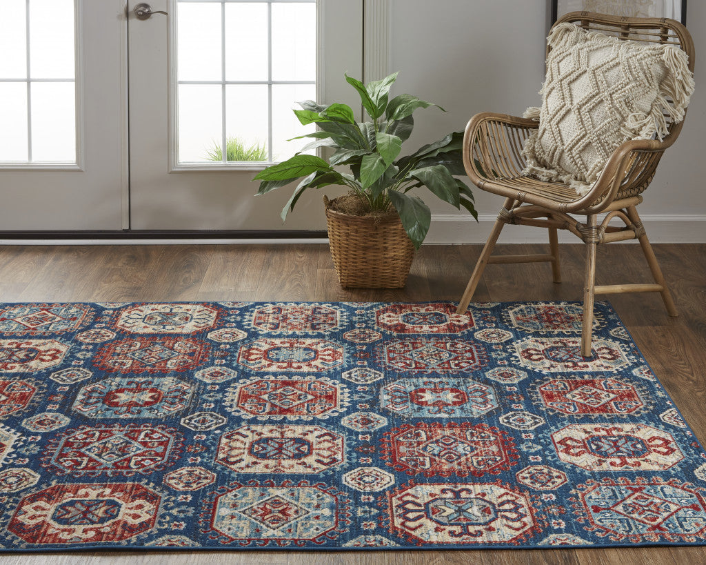 7' X 10' Blue Red And Tan Abstract Power Loom Distressed Stain Resistant Area Rug