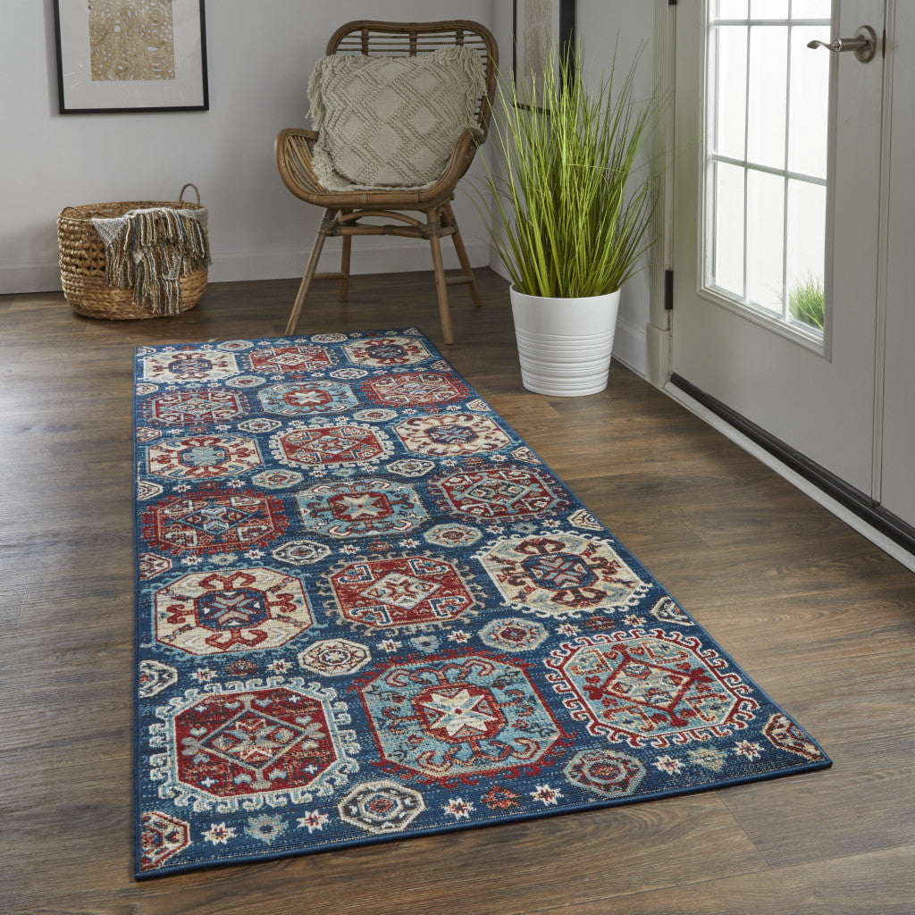 7' X 10' Blue Red And Tan Abstract Power Loom Distressed Stain Resistant Area Rug