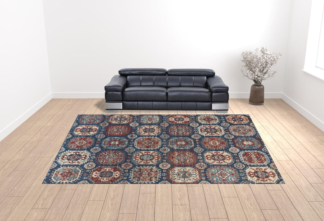 7' X 10' Blue Red And Tan Abstract Power Loom Distressed Stain Resistant Area Rug