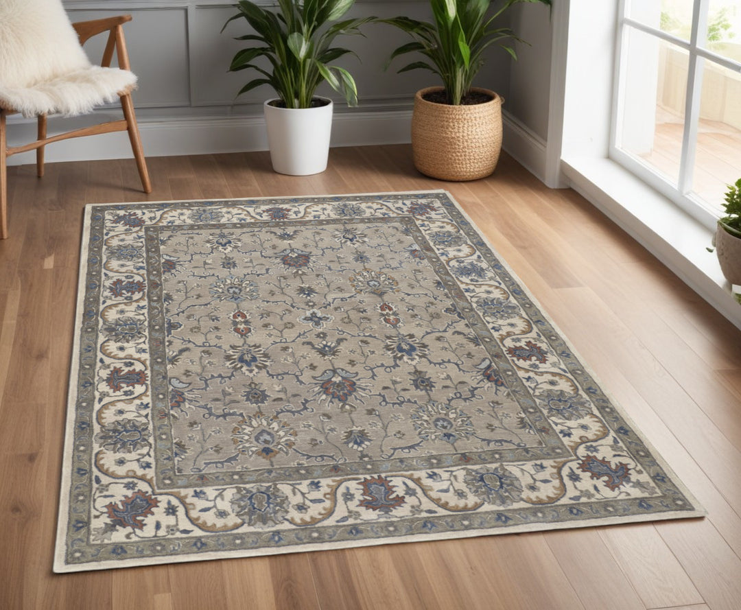 4' X 6' Ivory and Blue Wool Floral Hand Tufted Area Rug