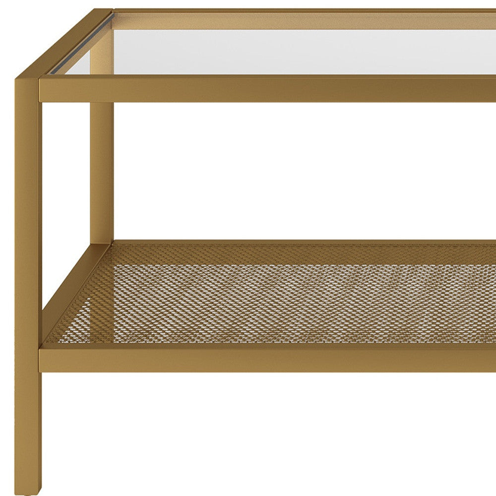 45" Clear and Gold Glass and Steel Coffee Table with Shelf