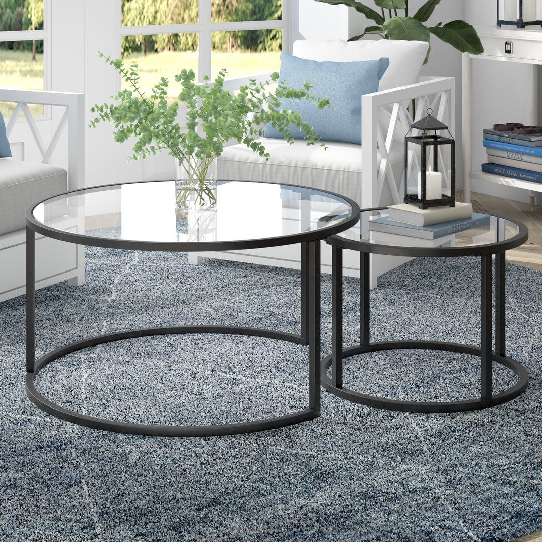 Set of Two 35-Inch Black Glass and Steel Round Nested Coffee Tables