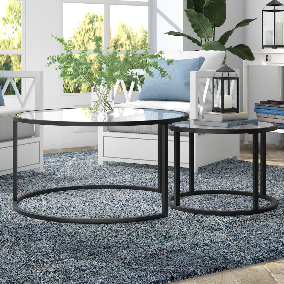 Set of Two 35-Inch Black Glass and Steel Round Nested Coffee Tables