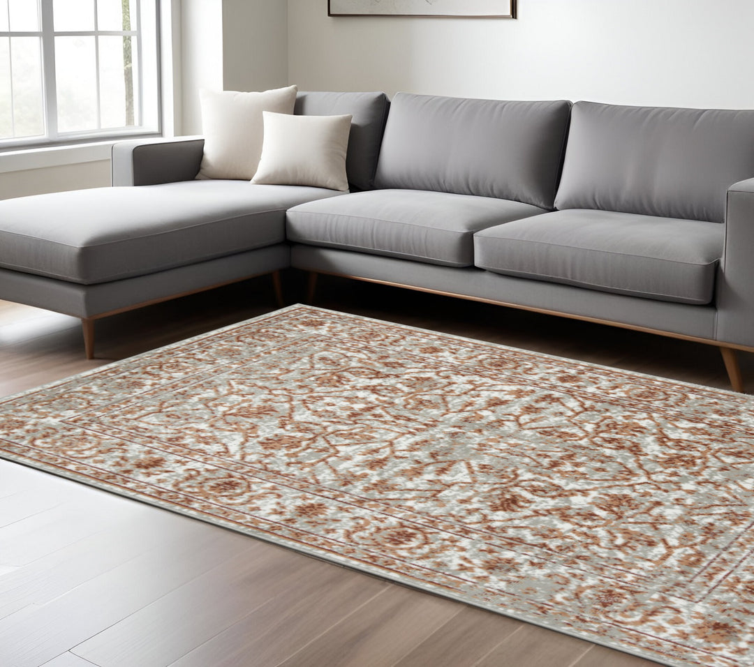 10' X 14' Rust and Gray Floral Power Loom Area Rug