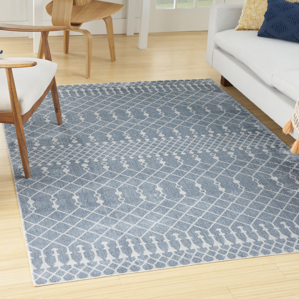 5' X 7' Blue and Ivory Abstract Power Loom Washable Area Rug