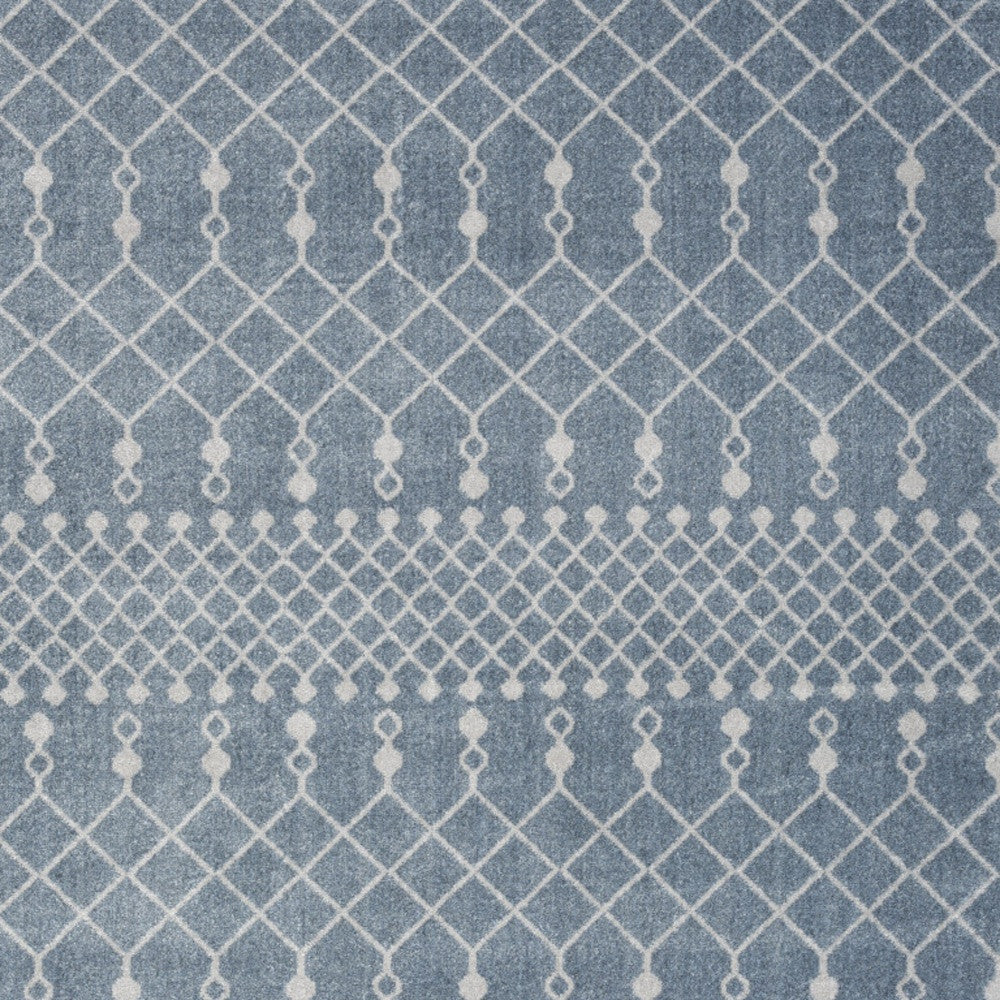 5' X 7' Blue and Ivory Abstract Power Loom Washable Area Rug