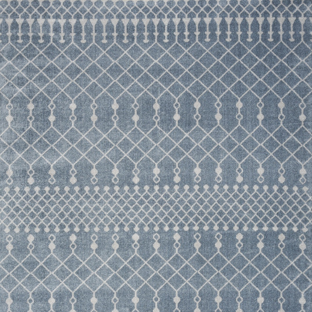 5' X 7' Blue and Ivory Abstract Power Loom Washable Area Rug