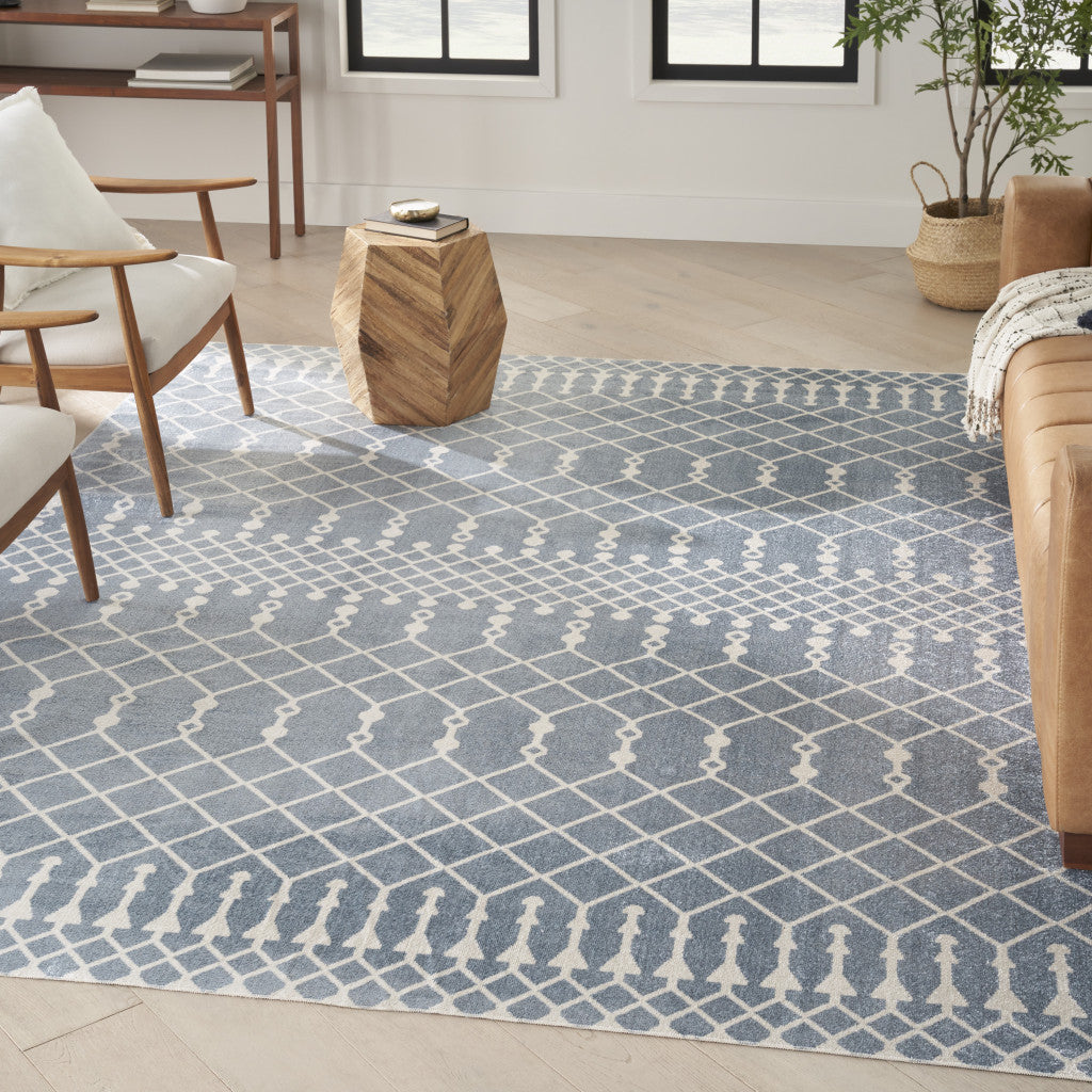 7' X 9' Blue and Ivory Abstract Power Loom Washable Area Rug