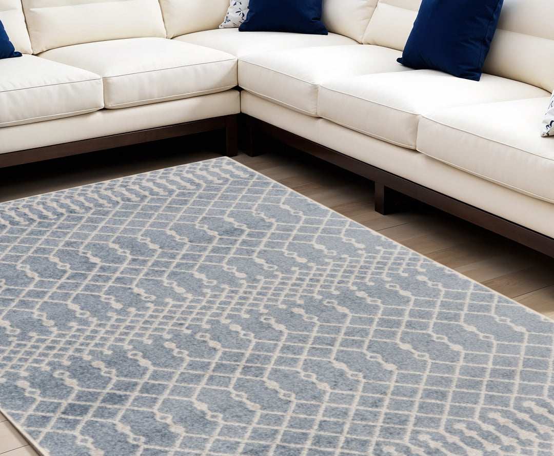 7' X 9' Blue and Ivory Abstract Power Loom Washable Area Rug