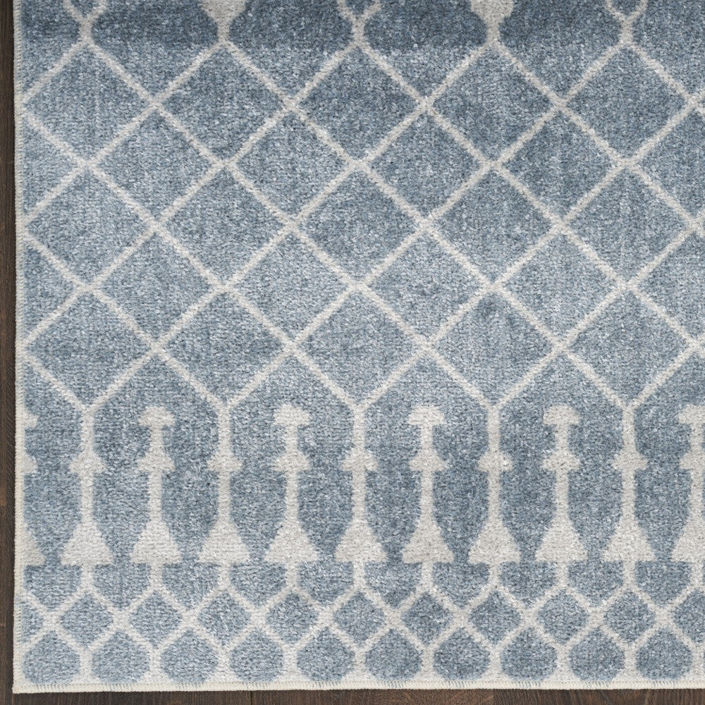 7' X 9' Blue and Ivory Abstract Power Loom Washable Area Rug